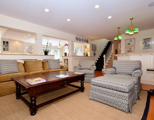130 Long Neck Point Road Darien, CT 06820 - Photo 9 of 20 a living room with furniture and a chandelier
