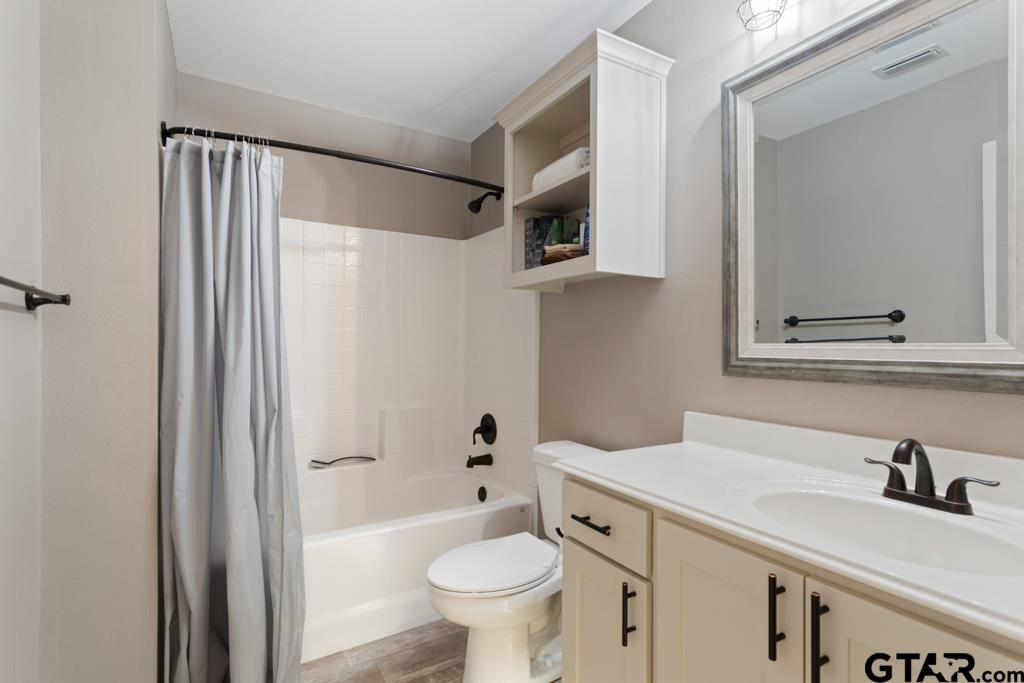 15422 Anna Lane Lindale, TX 75771 - Photo 20 of 28 a bathroom with a sink toilet and shower