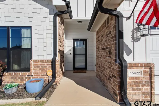 a front view of a house with outdoor seating