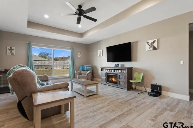 a living room with furniture and a flat screen tv