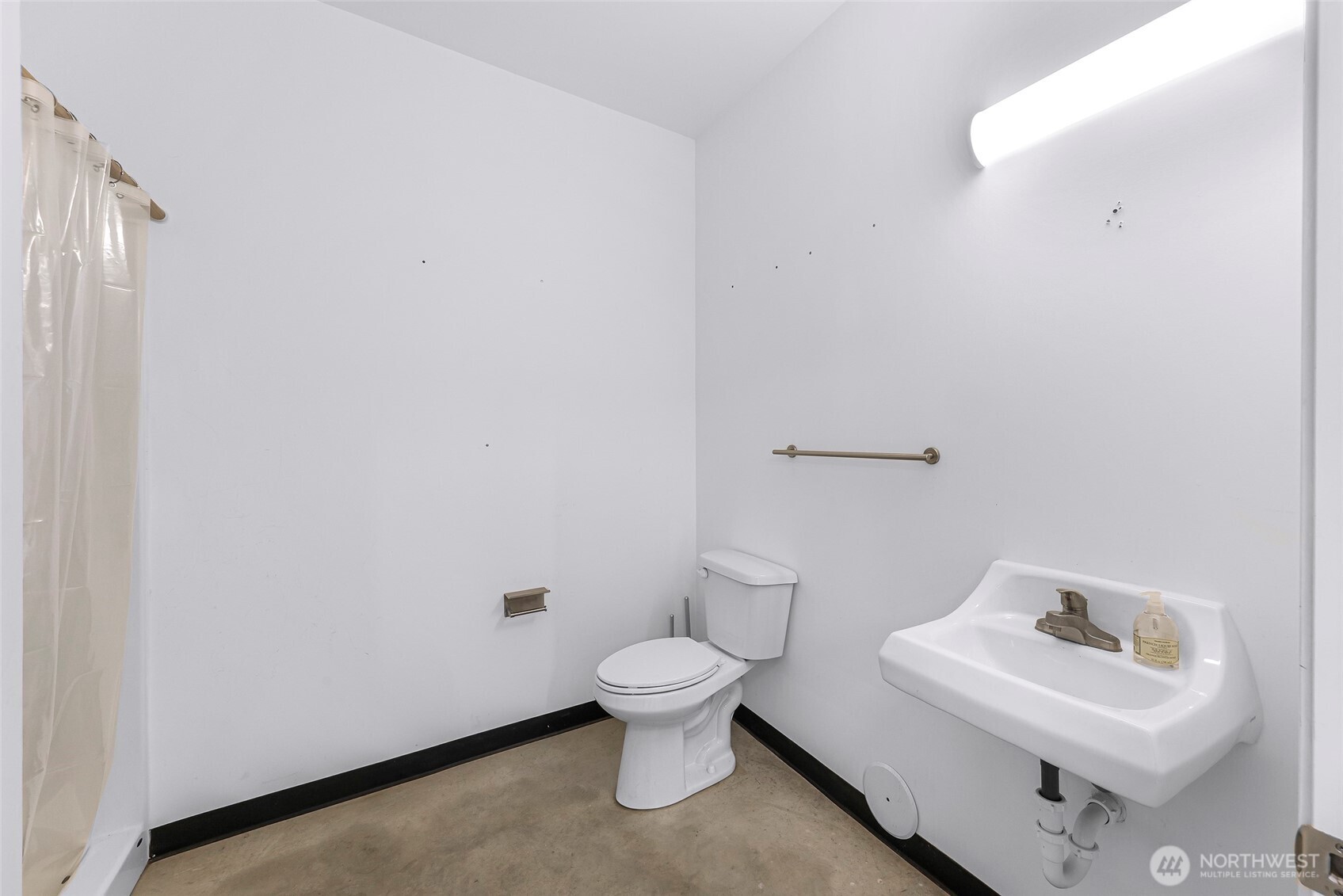 1957 Baltic Way, Unit 110 Ferndale, WA 98248 - Photo 13 of 26 a white toilet sitting next to a white sink