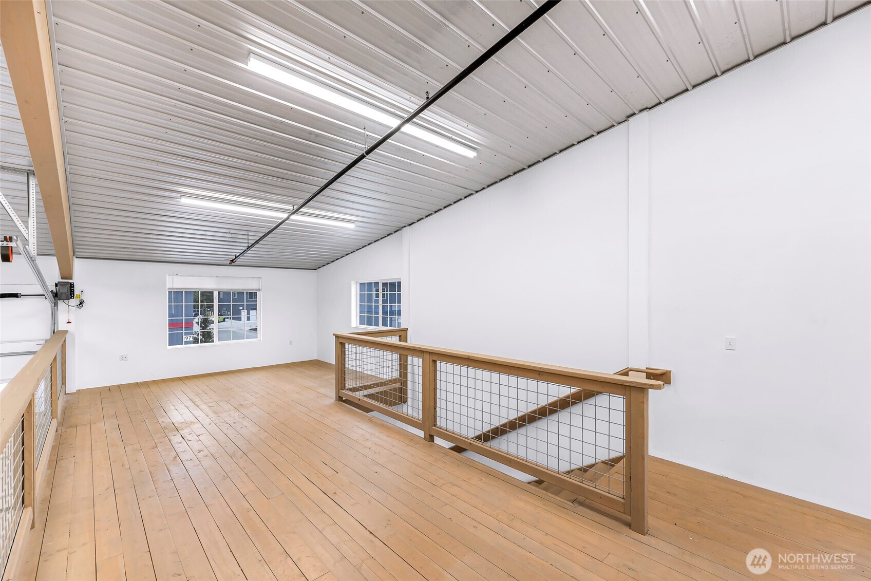 1957 Baltic Way, Unit 110 Ferndale, WA 98248 - Photo 15 of 26 a view of a hallway with wooden floor