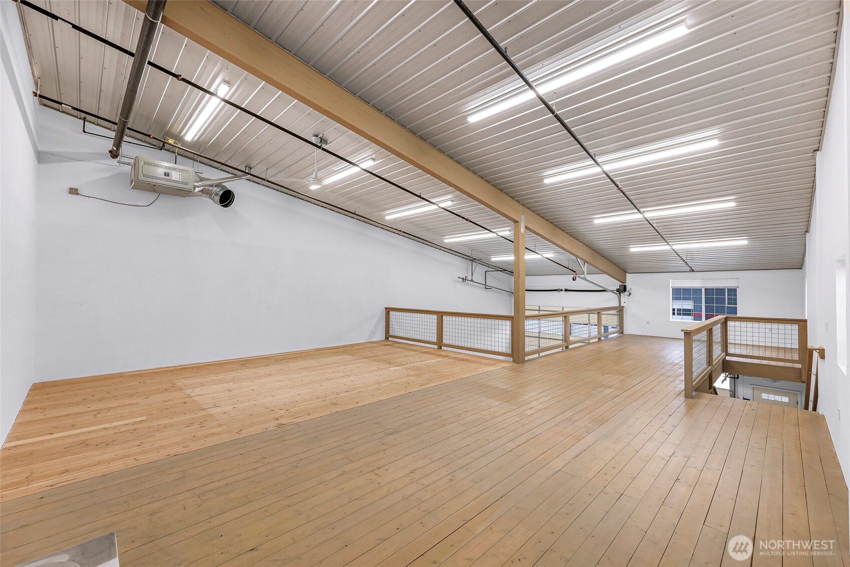 1957 Baltic Way, Unit 110 Ferndale, WA 98248 - Photo 16 of 26 a view of an empty room with wooden floor
