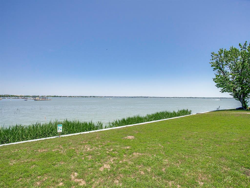 4492 Chaha Road, Unit 102 Garland, TX 75043 - Photo 20 of 40 a view of a lake with a big yard