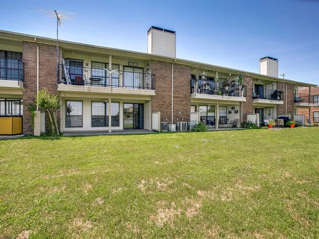 a front view of building with yard