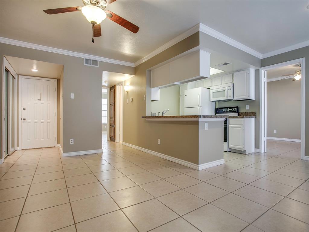 4492 Chaha Road, Unit 102 Garland, TX 75043 - Photo 27 of 40 a view of a kitchen with a sink and cabinets