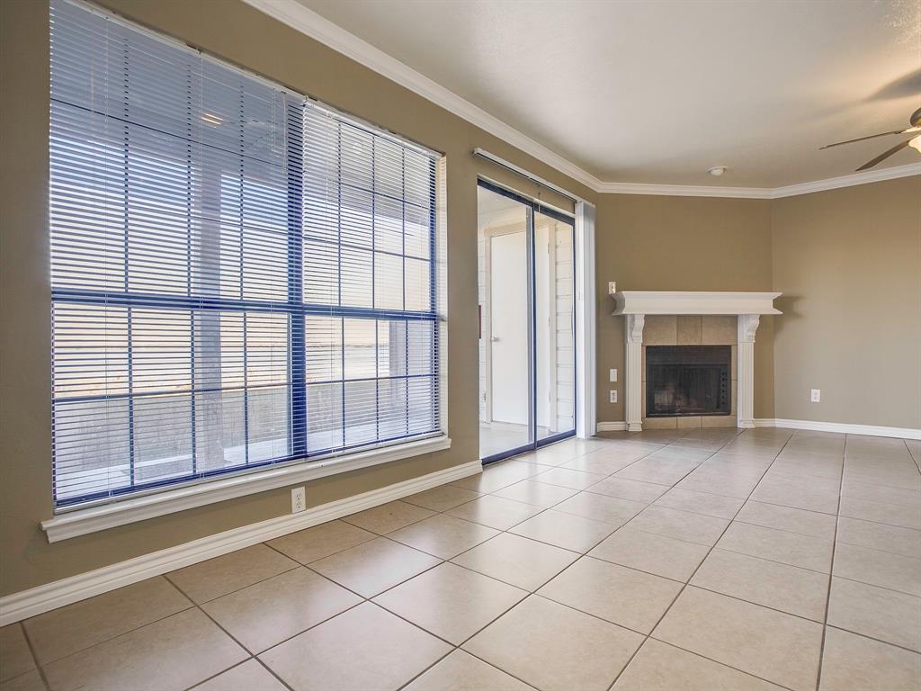 4492 Chaha Road, Unit 102 Garland, TX 75043 - Photo 32 of 40 a view of an empty room with a fireplace and a window