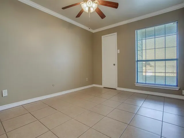 a view of an empty room with a bathroom