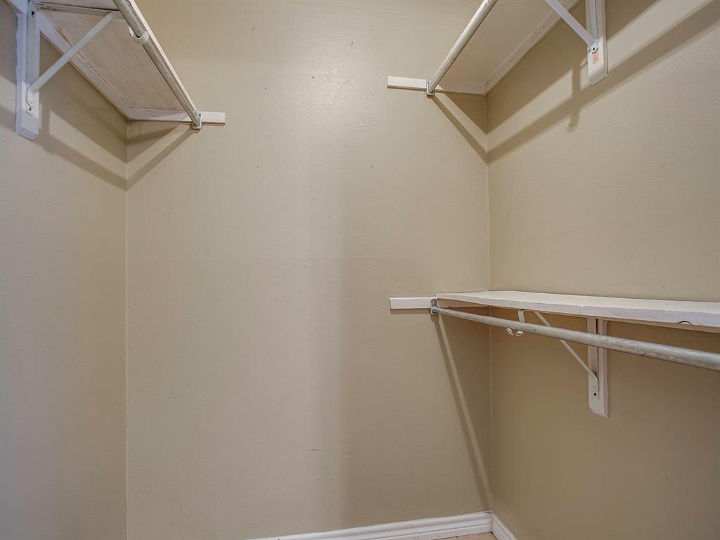 4492 Chaha Road, Unit 102 Garland, TX 75043 - Photo 37 of 40 a view of a room with racks on the wall