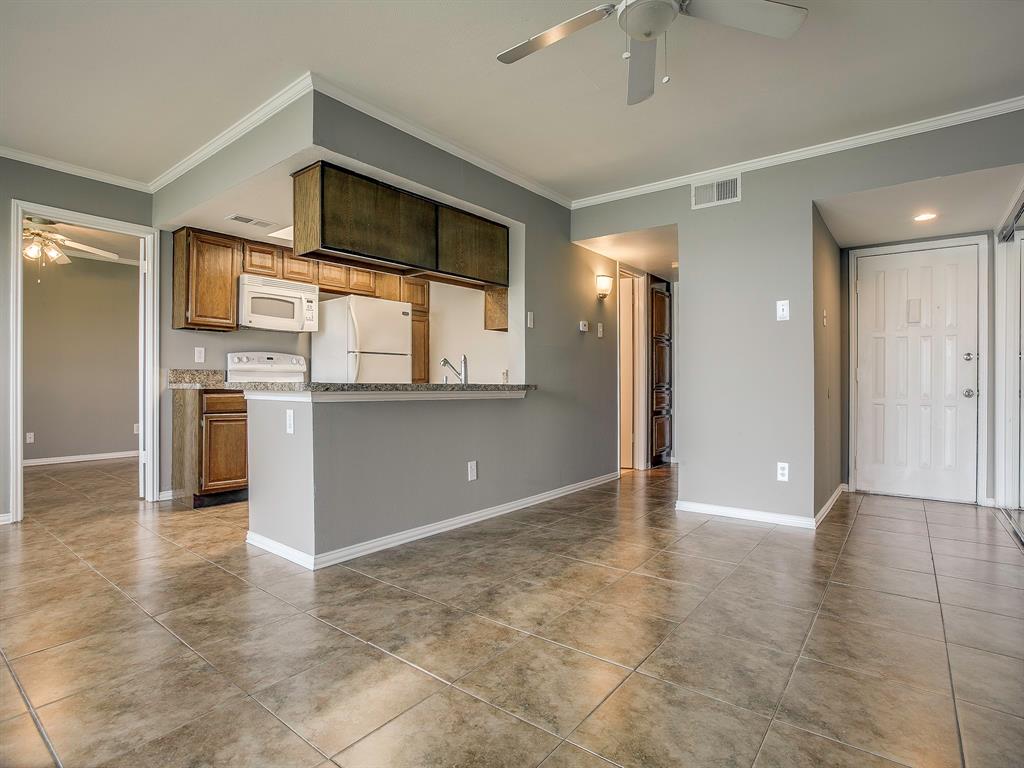4492 Chaha Road, Unit 102 Garland, TX 75043 - Photo 6 of 40 a view of a kitchen with a sink and a stove top oven