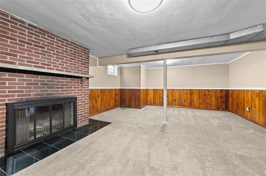 4948 Ashbaugh Road Murrysville, PA 15668 - Photo 38 of 48 Lower Level Game room with Log Fireplace