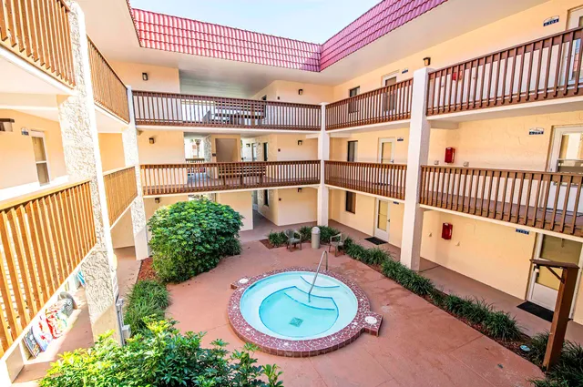 a view of balcony with a swimming pool