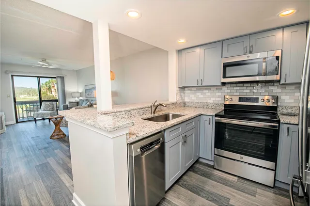 a kitchen with a stove and a microwave