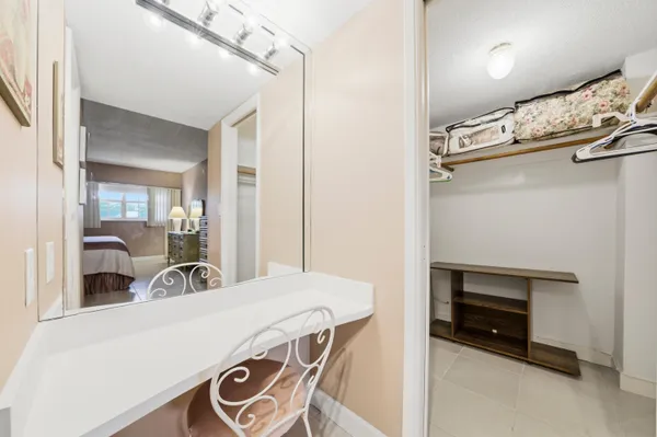 a bedroom with a bed and a table in it