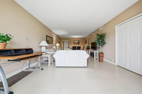 a living room with furniture and a table