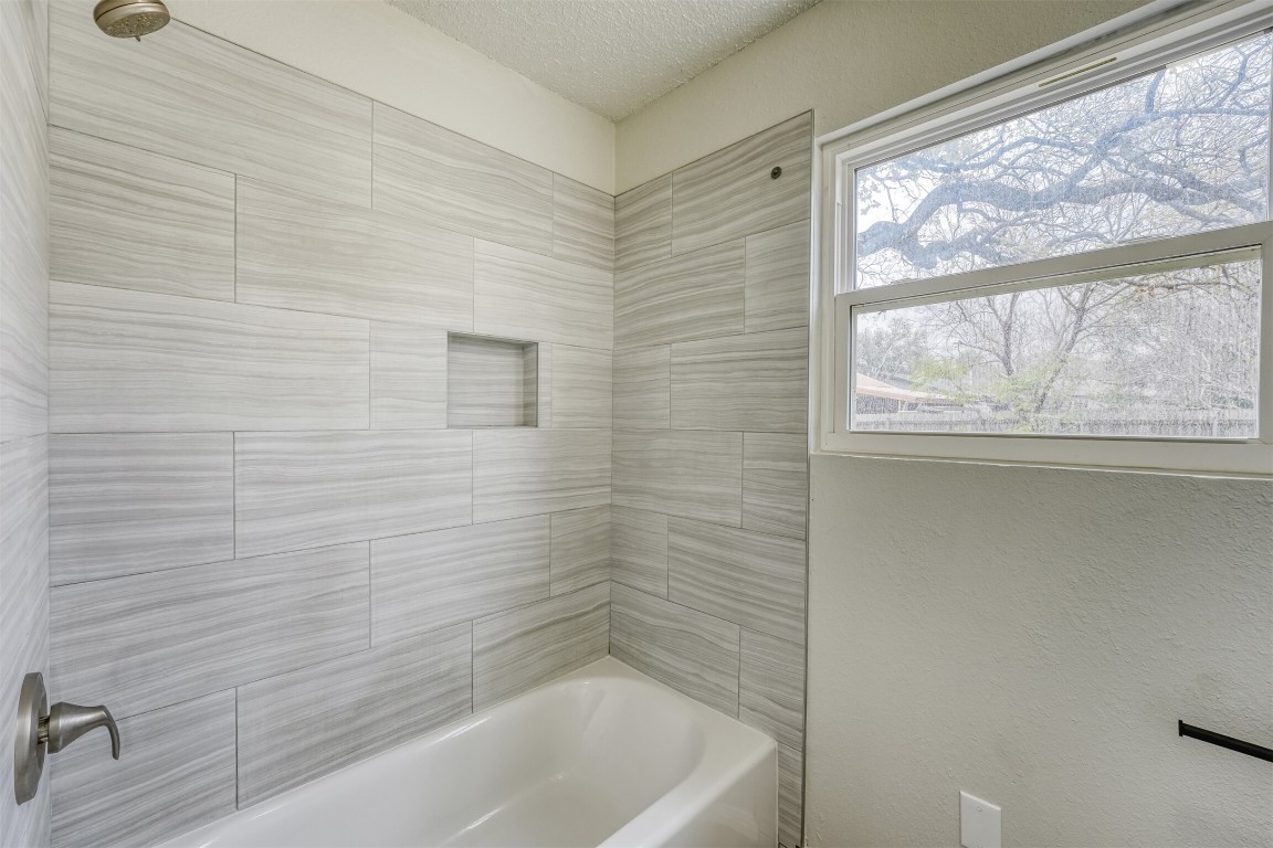 1002 Rambling Trail Cedar Park, TX 78613 - Photo 18 of 23 a bathroom with a bathtub