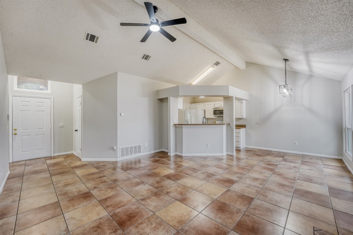 1002 Rambling Trail Cedar Park, TX 78613 - Photo 2 of 23 a view of a kitchen with a sink and a refrigerator