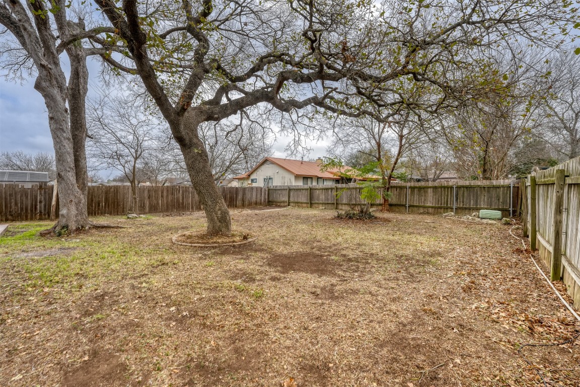 1002 Rambling Trail Cedar Park, TX 78613 - Photo 21 of 23 a backyard of a house with lots of green space