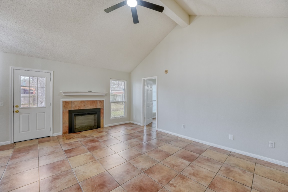 1002 Rambling Trail Cedar Park, TX 78613 - Photo 4 of 23 an empty room with fireplace and fan