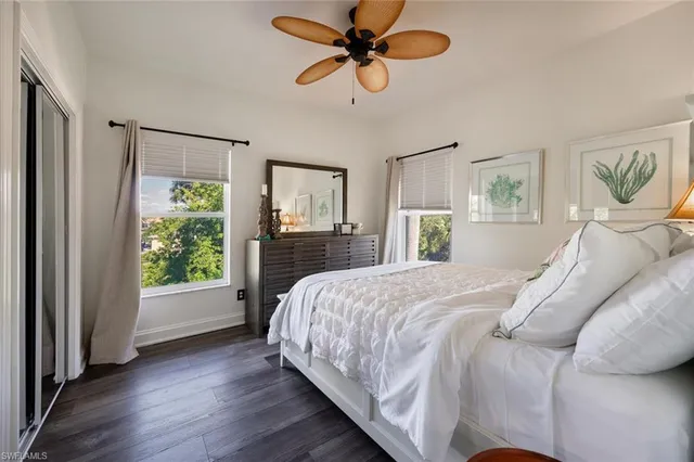 a kitchen with refrigerator and cabinets
