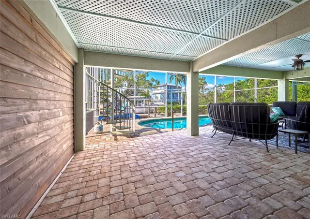 a living room with furniture a rug and a window