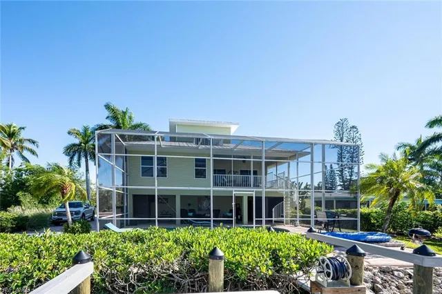 a view of a backyard with sitting area