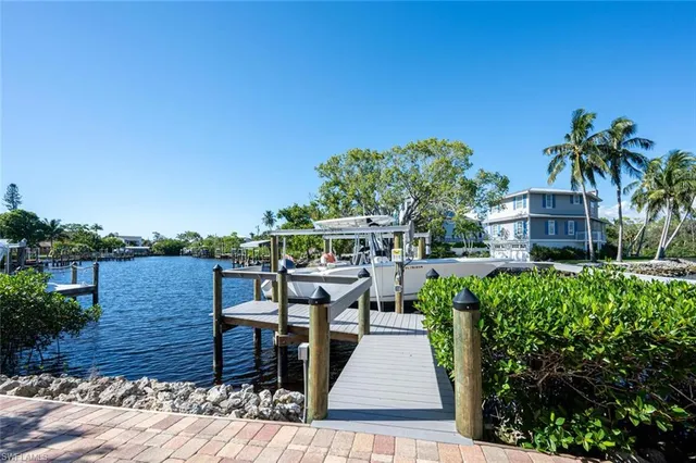a view of residential house with outdoor space and lake view