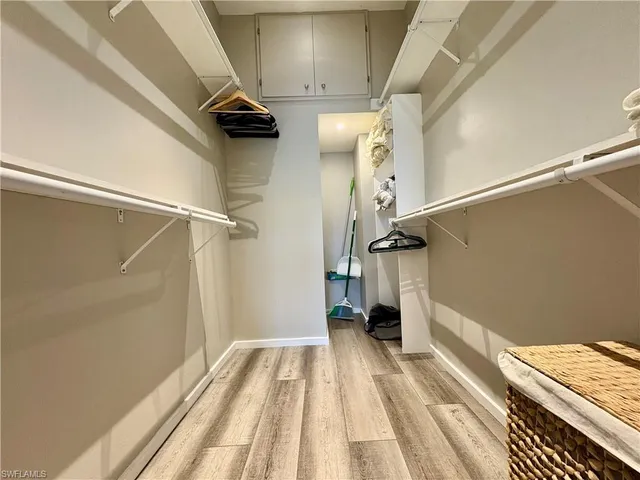 a spacious bathroom with a granite countertop sink mirror and shower