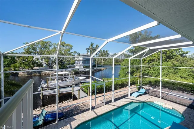 a view of a swimming pool with a lounge chairs