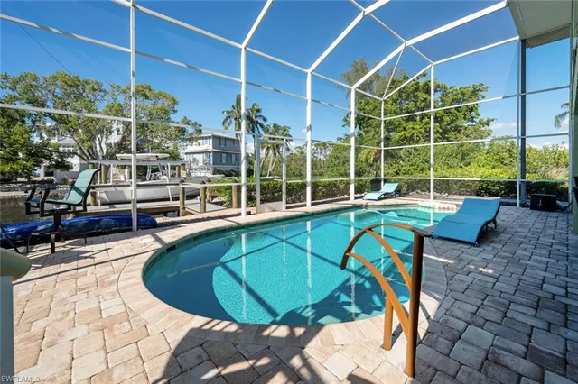 a view of a swimming pool with a patio