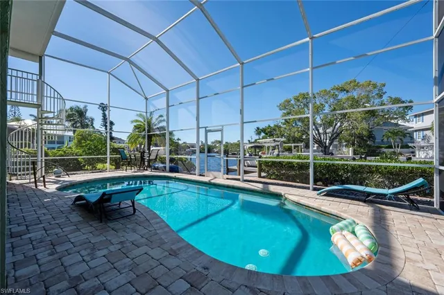 a view of an entryway door and wooden floor