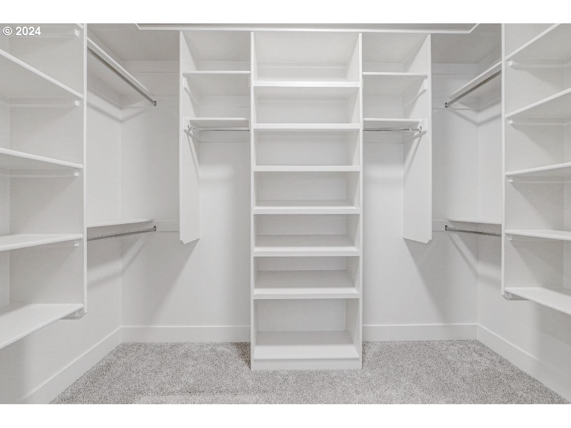 4120 South 17th Way Ridgefield, WA 98642 - Photo 14 of 20 a view of a room with shelf on the wall