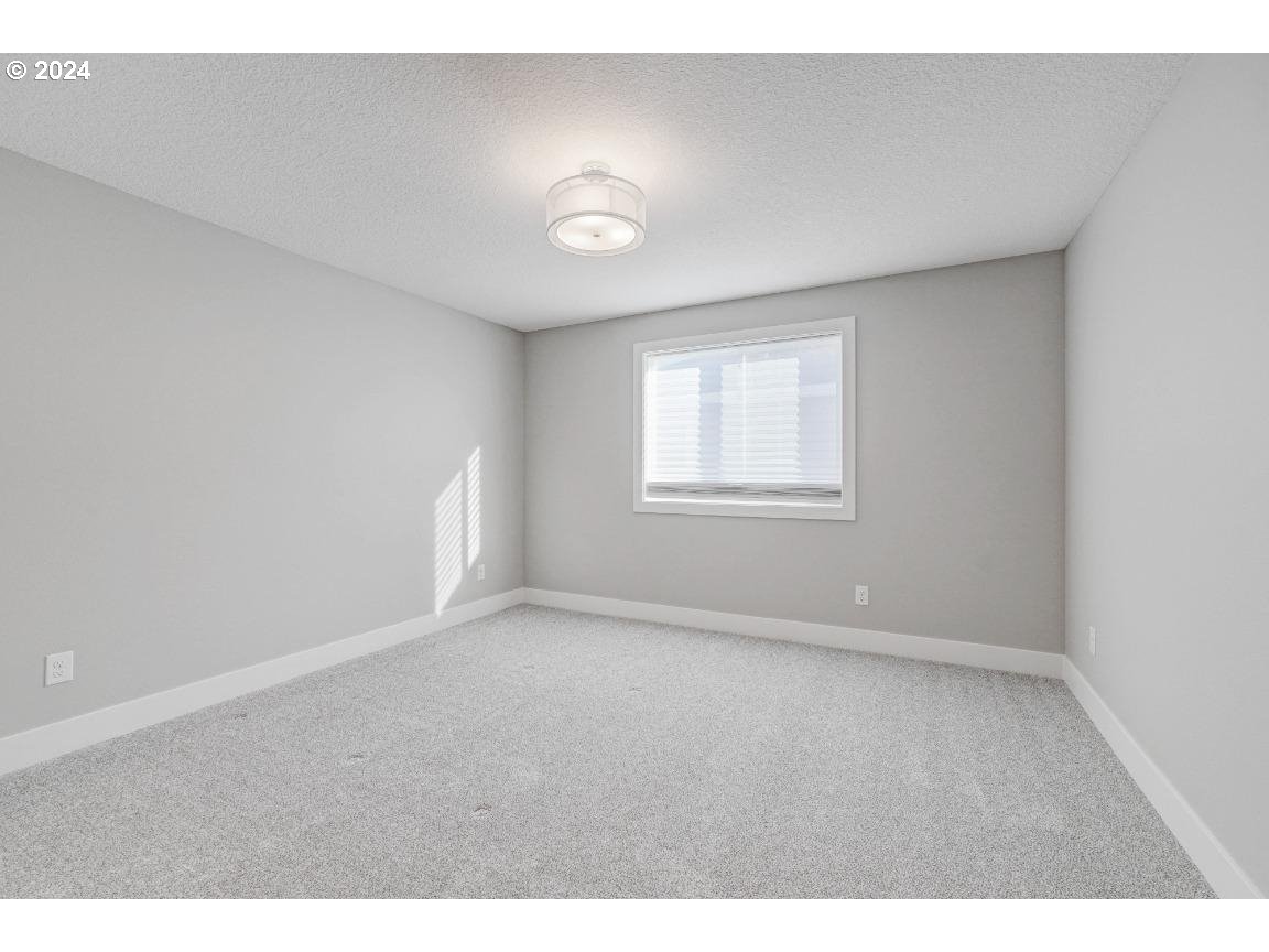 4120 South 17th Way Ridgefield, WA 98642 - Photo 17 of 20 a view of an empty room with a window