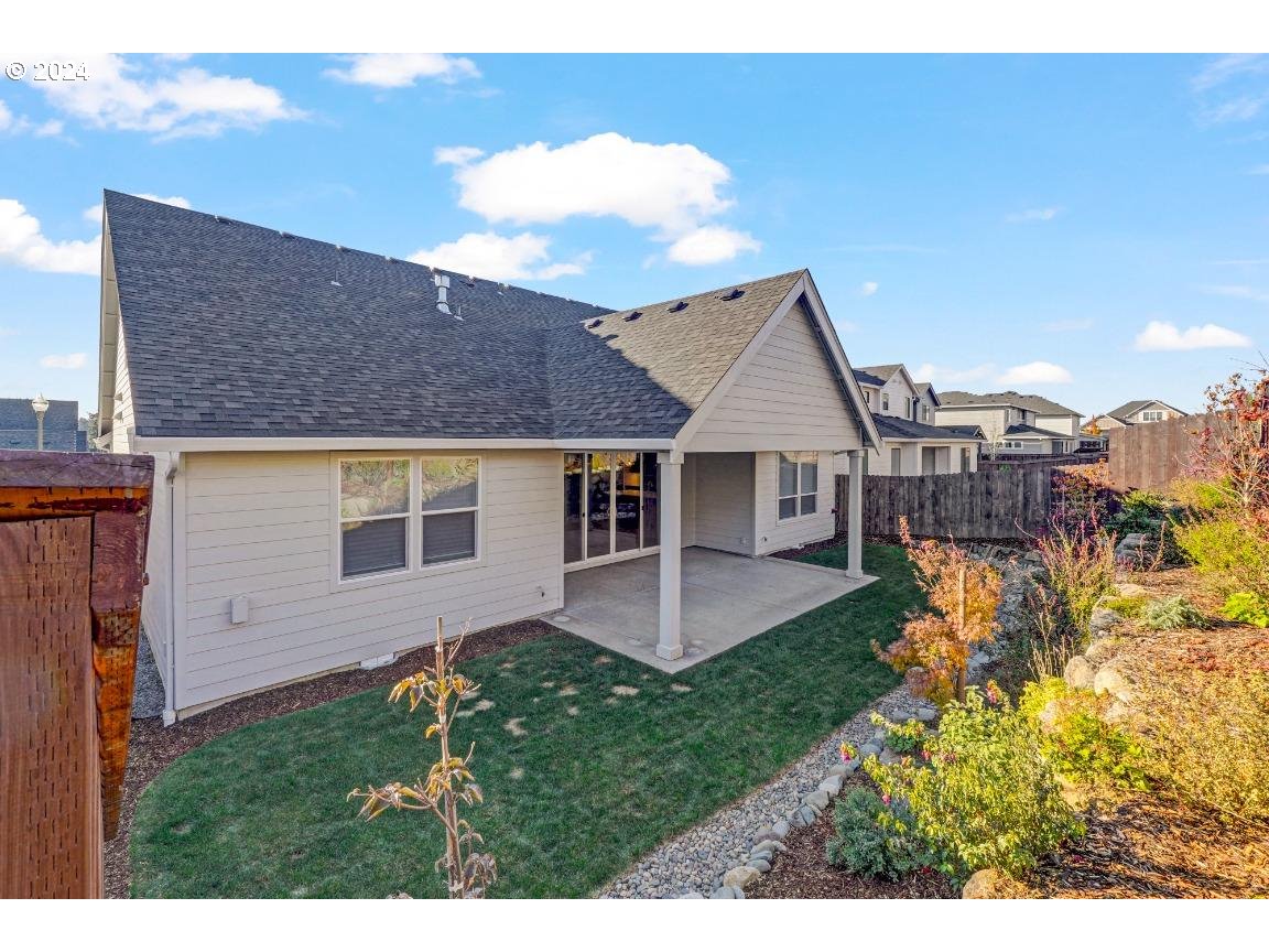 4120 South 17th Way Ridgefield, WA 98642 - Photo 20 of 20 a front view of a house with a garden and yard