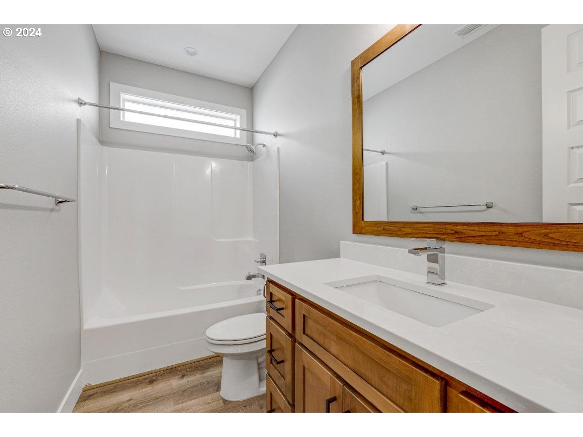 4120 South 17th Way Ridgefield, WA 98642 - Photo 4 of 20 a bathroom with a sink a toilet and shower