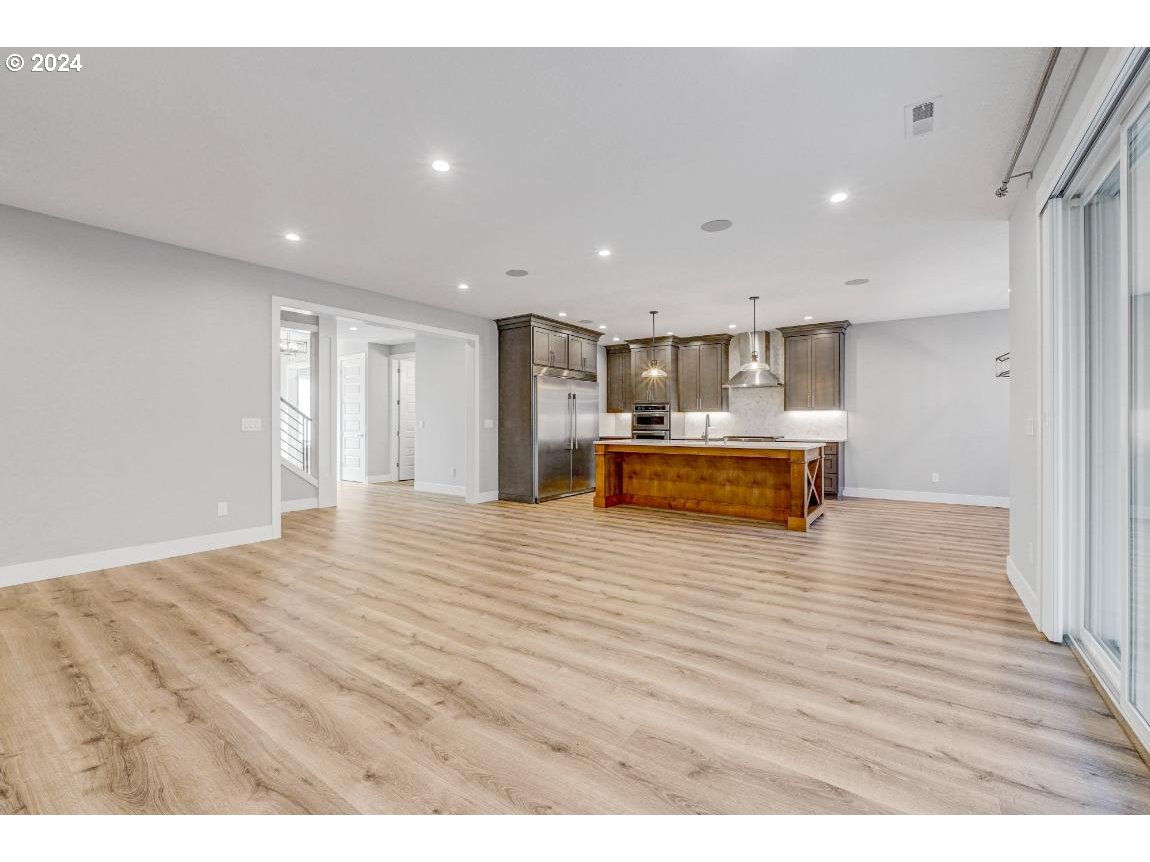 4120 South 17th Way Ridgefield, WA 98642 - Photo 7 of 20 a view of kitchen and wooden floor