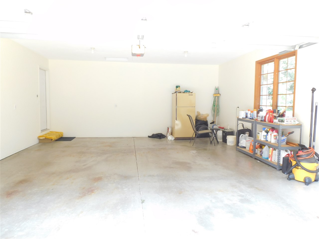 10062 Beaver Valley Road Belvidere, IL 61008 - Photo 18 of 25 a view of a room with furniture and a flat screen tv
