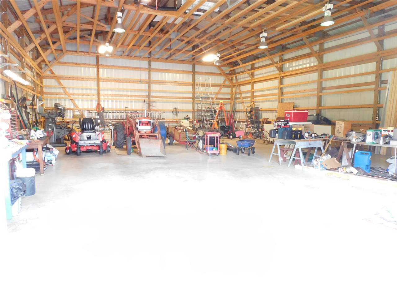 10062 Beaver Valley Road Belvidere, IL 61008 - Photo 21 of 25 a view of a garage with a large tree
