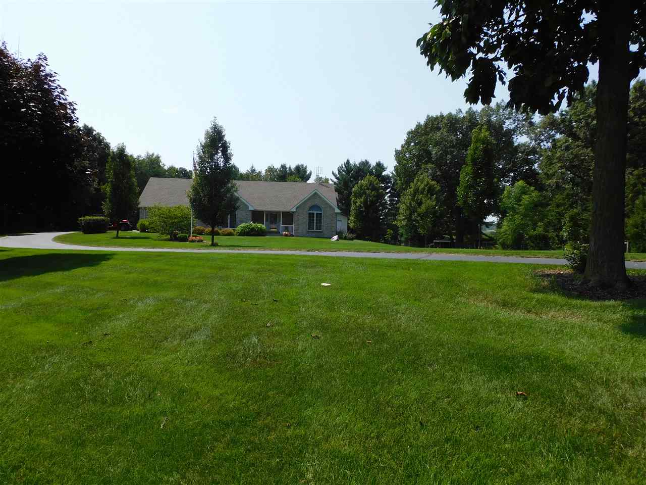 10062 Beaver Valley Road Belvidere, IL 61008 - Photo 25 of 25 a view of a grassy field with trees