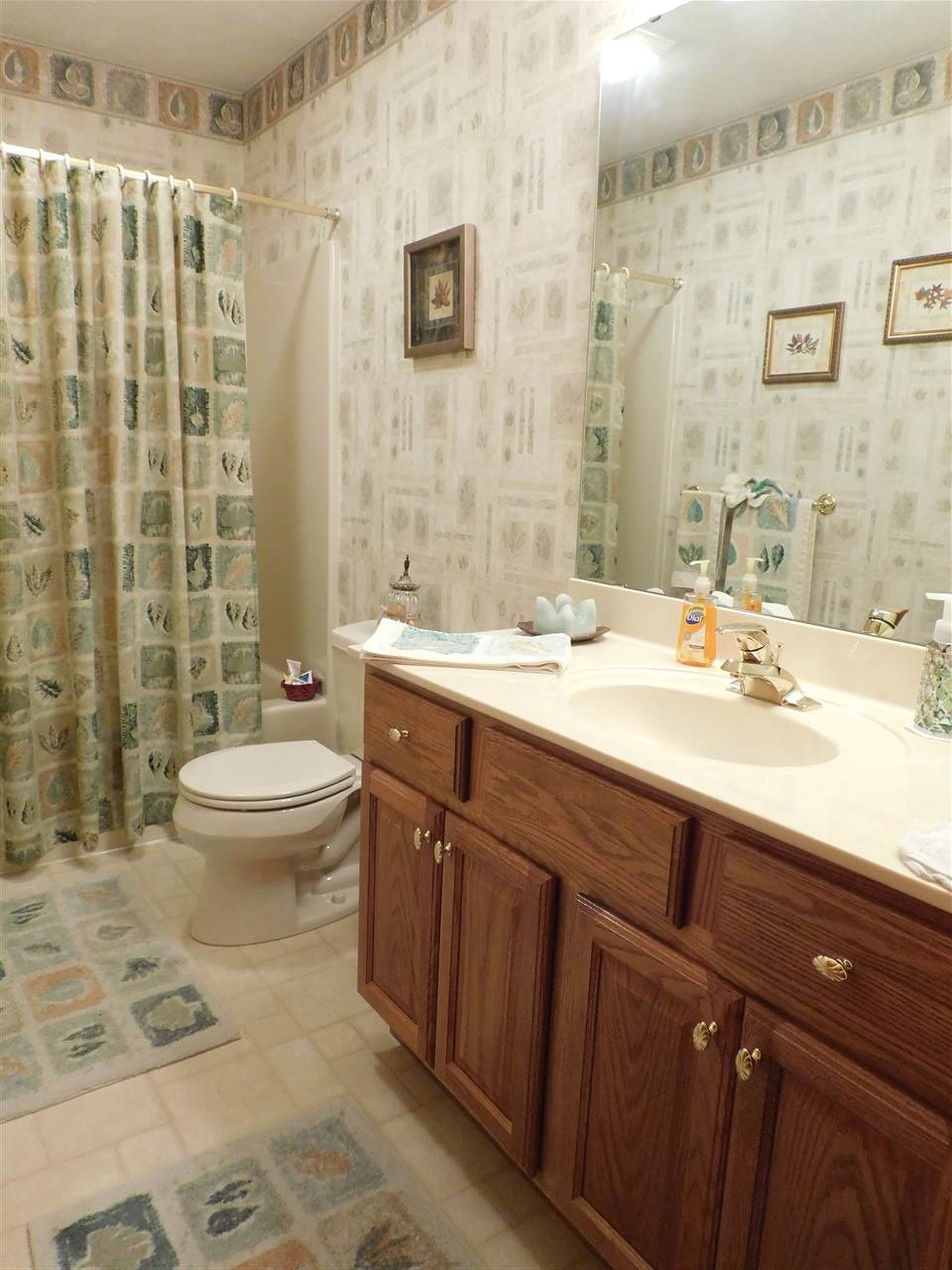 10062 Beaver Valley Road Belvidere, IL 61008 - Photo 8 of 25 a bathroom with a double vanity sink toilet and shower