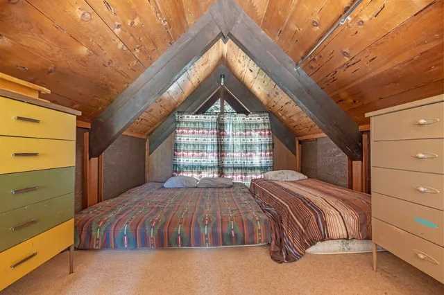 a view of balcony with wooden floor and fence