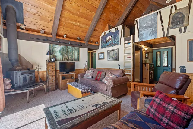 a outdoor living space with patio furniture and a fireplace