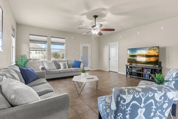 a living room with furniture and a flat screen tv