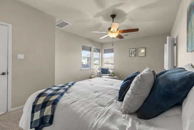 a bedroom with a bed and window