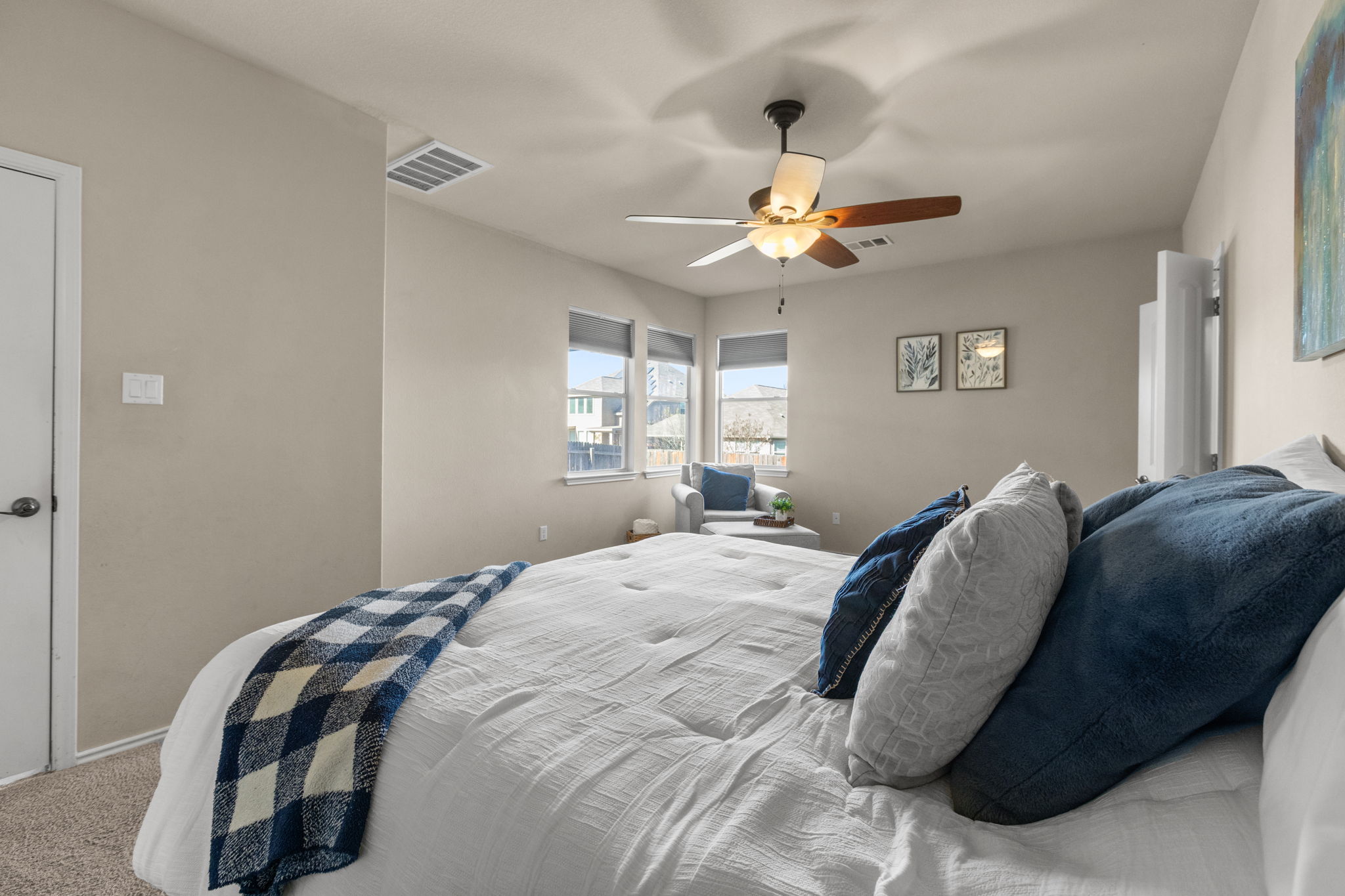 221 Blossom Valley Streme Buda, TX 78610 - Photo 21 of 40 a bedroom with a bed and a window