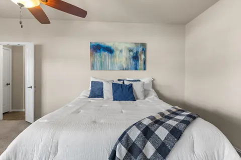 a bedroom with a bed and window