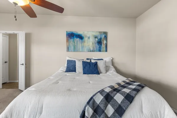 a bedroom with a bed and window