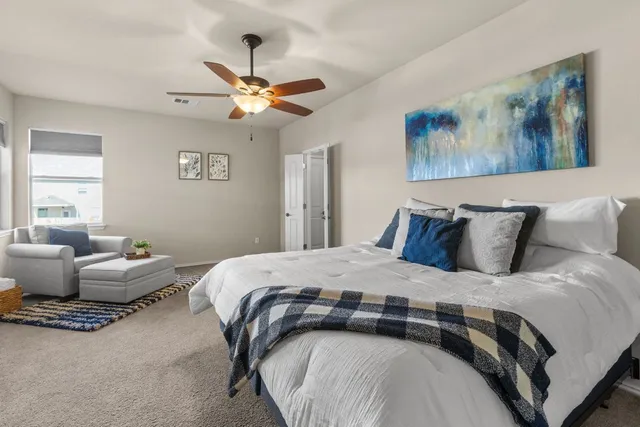 a bedroom with a bed and window