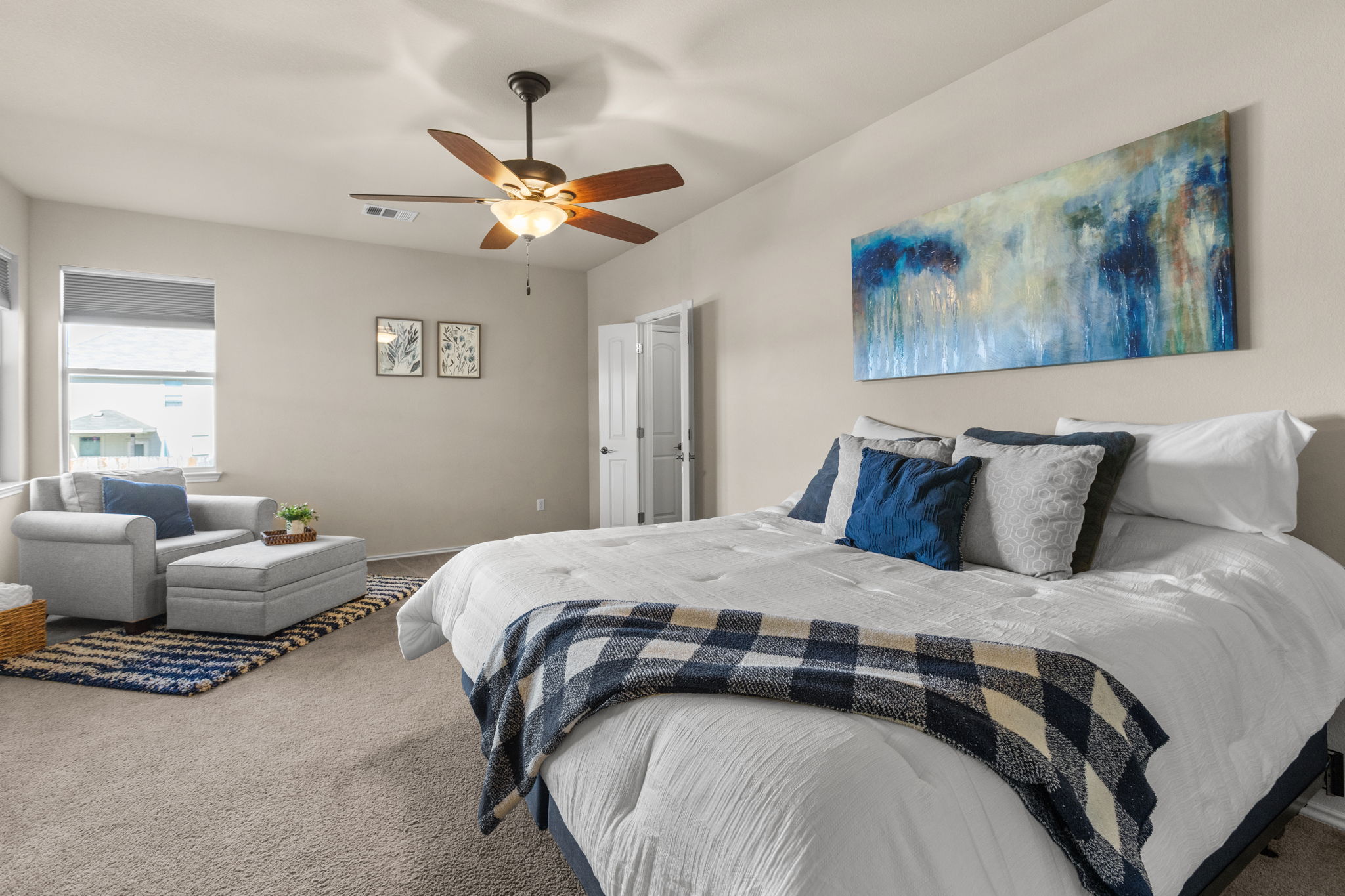 221 Blossom Valley Streme Buda, TX 78610 - Photo 23 of 40 a bedroom with a bed and window