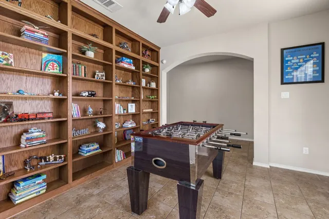 a view of a workspace with bookshelf